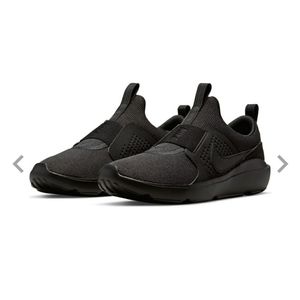 Solid black slip on Nike shoes
